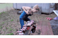 trying-and-failing-at-crushing-beer-cans-with-boobs.gif