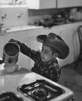 6 yr. old cowboy pouring some coffee 1954.jpg