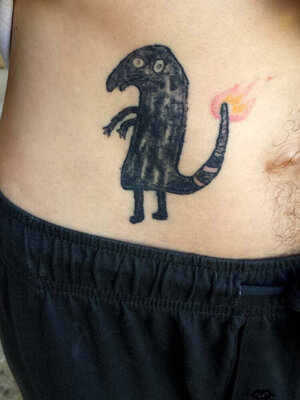 My-friend-was-drunk-and-he-decided-to-tattoo-a-black-face-Charmander-with-no-experience-or-art...jpg